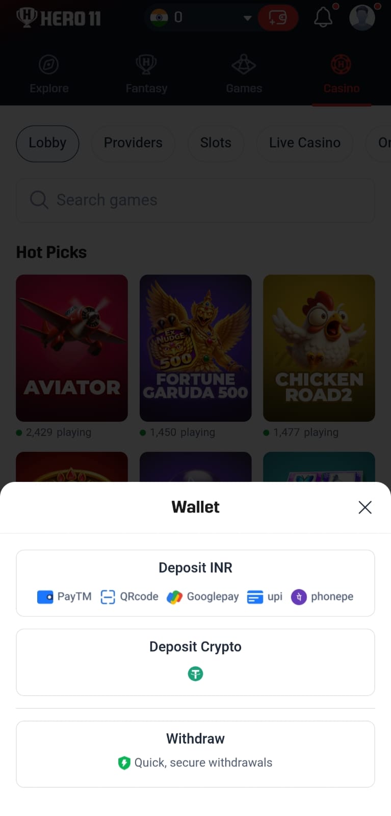 Hero11 app screenshot showing casino game categories and wallet options for INR deposits, crypto deposits, and withdrawals.